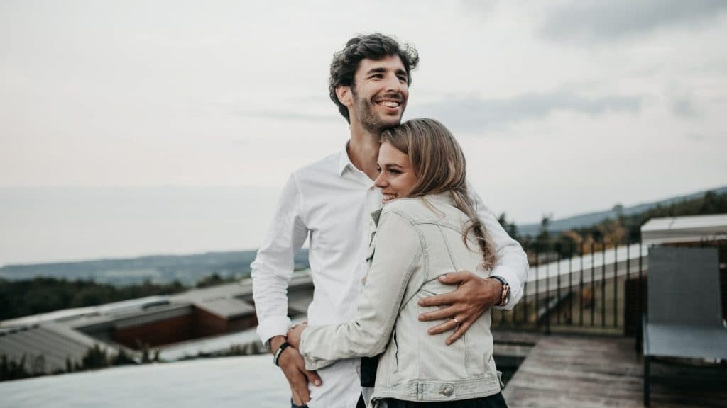 man and woman hugging each other